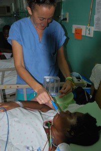 Patient with Spinal Cord Injury uses a spirometer to improve lung capacity and the transport of air into the lungs Patient with Spinal Cord Injury uses a spirometer to improve lung capacity and the transport of air into the lungs